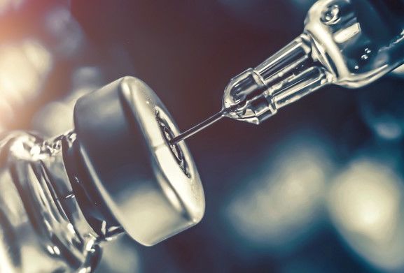 Novel Coronavirus (2019-nCoV) Corona virus vaccine vial dose flu shot drug needle syringe medical concept vaccination hypodermic injection treatment disease care hospital prevention immunization